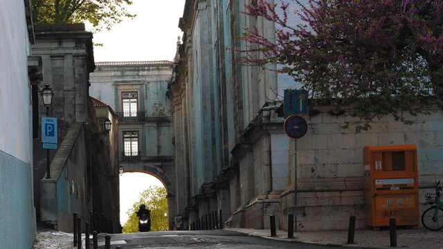 Home delivery bike with a medieval bridge in the background, near Gra&ccedil;a in Lisbon, Portugal
