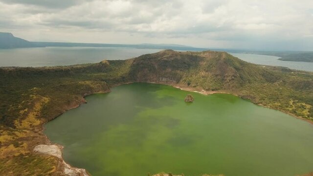 aerial footage lake crater at taal Volcano Luzon Philippines. Volcano with crater on an island in middle lake. Travel concept. Aerial video.