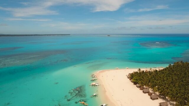aerial footage tropical island with beach and palm trees lagoon with turquoise water Sea tropical landscape Daco island, Philippines, Siargao. Travel concept Aerial video