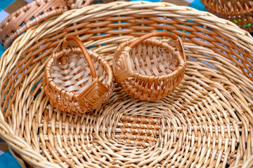 Two small wicker baskets and one large basket.