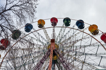 deserted ferris wheel in spring amusement park