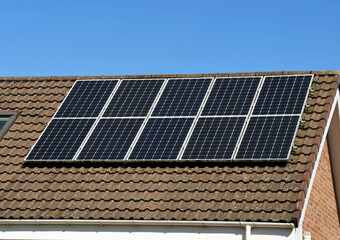 Fototapeta premium Solar panels installed on the roof of a house. No people.