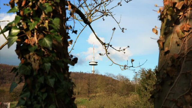 The television tower of Porta Westfalica on the Wesergebirge and Jakobsberg between two trees