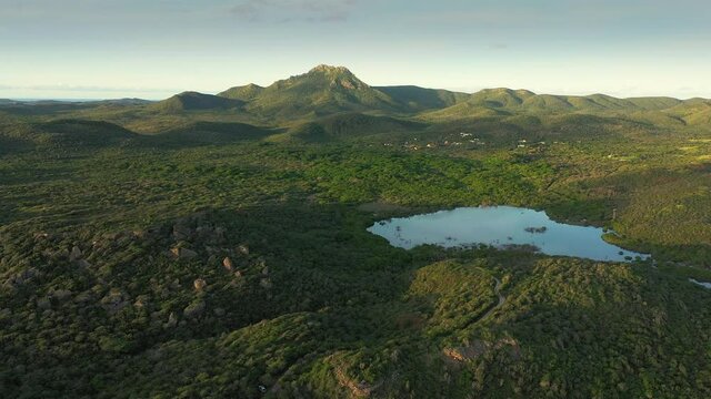 Aerial view above scenery of Curacao, Caribbean with lake and mountains