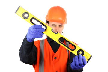 female builder or repairer in hardhat and safety holds building level. Isolated on white