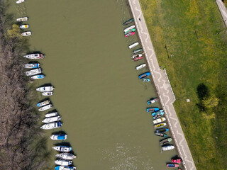 Fototapeta na wymiar drone view of river boats at spring day. Preparation of boats for fishing. From the river Tamis, Pancevo Serbia.