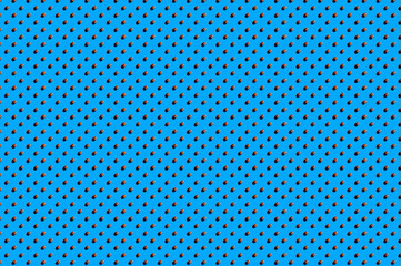 Hazelnuts background. A trendy sunlight pattern made of hazelnuts against a bright blue background. Colorful pattern. Top view