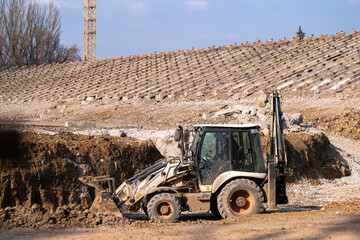 Tractor workig to Construction of a New Stadium.