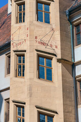 Obraz premium antique sundial on the wall of a house in the small German town of Rothenburg ob der Tauber