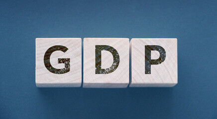 GDP, Gross Domestic Product concept, cube wooden block with alphabet combine abbreviation GDP,...