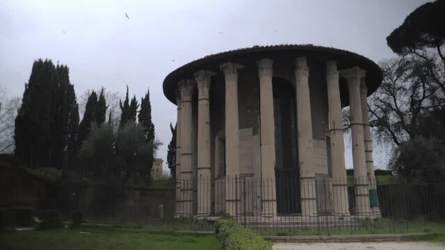 Panoramic view on temple of Hercules, located on Piazza della Bocca della Verita' , in front of the Basilica of Santa Maria in Cosmedin 