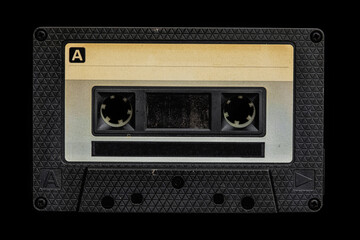 old audio cassette tape on black background