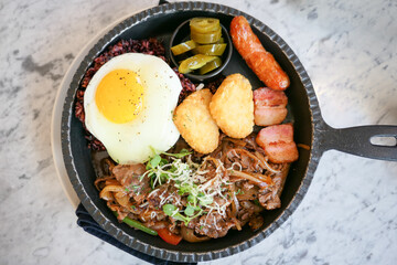 brunch plating with sunny side up fried egg