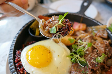 brunch plating with sunny side up fried egg