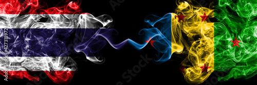 Thailand, Thai vs Ogoni people smoky mystic flags placed side by side. Thick colored silky abstract smokes flags.