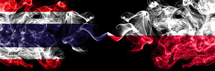 Thailand, Thai vs Poland, Polish, Pole smoky mystic flags placed side by side. Thick colored silky abstract smokes flags.