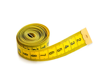Yellow isolated metric measuring tape isolated on white background. Centimeter, close-up