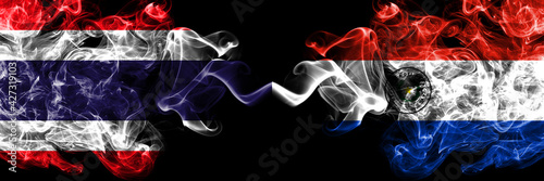 Thailand, Thai vs Paraguay, Paraguayan smoky mystic flags placed side by side. Thick colored silky abstract smokes flags.