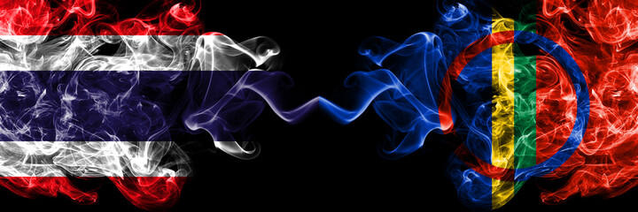 Thailand, Thai vs Sami smoky mystic flags placed side by side. Thick colored silky abstract smokes flags.