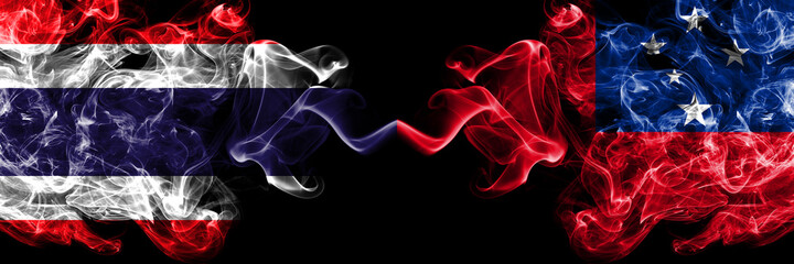 Thailand, Thai vs Samoa smoky mystic flags placed side by side. Thick colored silky abstract smokes flags.