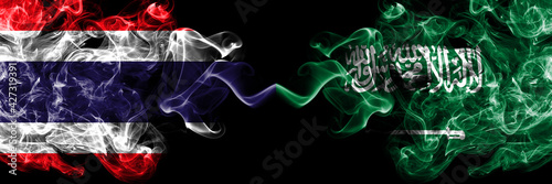 Thailand, Thai vs Saudi Arabia, Arabian smoky mystic flags placed side by side. Thick colored silky abstract smokes flags.