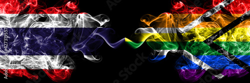 Thailand, Thai vs South Africa, African, gay  smoky mystic flags placed side by side. Thick colored silky abstract smokes flags.
