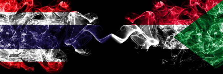 Thailand, Thai vs Sudan smoky mystic flags placed side by side. Thick colored silky abstract smokes flags.