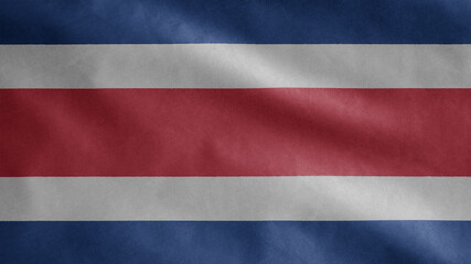 Costa Rica flag waving in the wind. Close up of Costa Rican banner blowing silk.