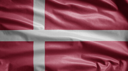 Danish flag waving in the wind. Close up of Denmark banner blowing soft silk.