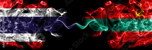 Thailand, Thai vs Transnistria smoky mystic flags placed side by side. Thick colored silky abstract smokes flags.