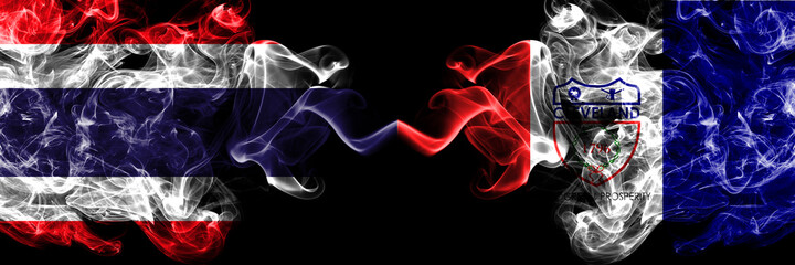 Thailand, Thai vs United States of America, America, US, USA, American, Cleveland, Ohio smoky mystic flags placed side by side. Thick colored silky abstract smokes flags.
