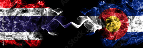 Thailand, Thai vs United States of America, America, US, USA, American, Colorado smoky mystic flags placed side by side. Thick colored silky abstract smokes flags.