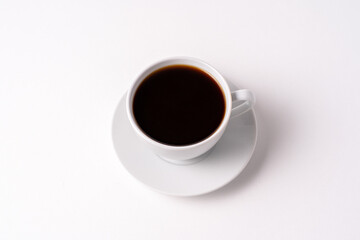 Black coffee in a white cup isolated on white background.