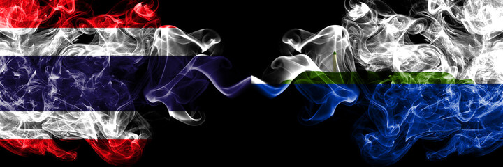 Thailand, Thai vs United States of America, America, US, USA, American, Navassa Island smoky mystic flags placed side by side. Thick colored silky abstract smokes flags.
