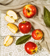 Ripe red apples  with leaves on rustic tile.Top view.