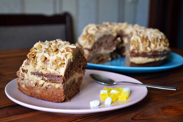 Fototapeta na wymiar Homemade cake with walnuts and custard