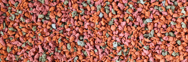 Multi colored pellets for animal feeding closeup