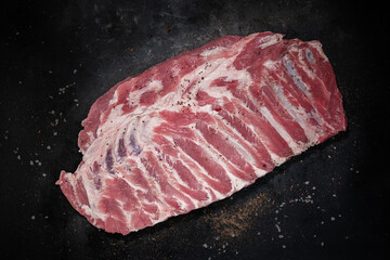 Pork ribs grilled with BBQ sauce on wooden board