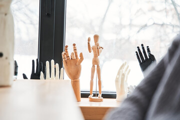 Different hands standing at the windowsill at the office of the engineers