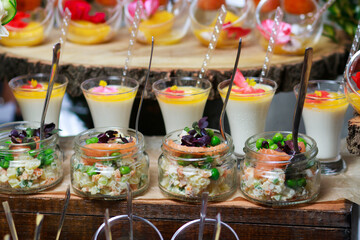 Olivier salad in a jar. Banquet snack. Catering.