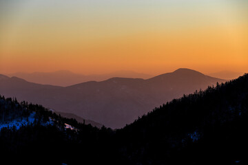 Travel across the Primorsky Territory. View of the valley from the top of the mountain during a golden sunset.