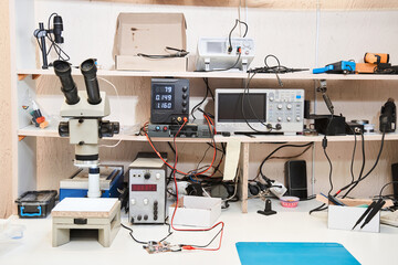 Table at the office or laboratory with microscope and special tools