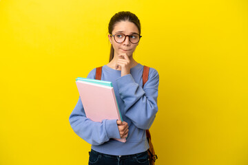 Student kid woman over isolated yellow background having doubts and thinking