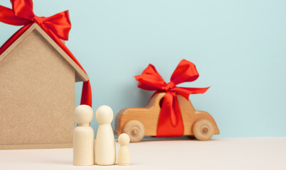 wooden house and car with miniature family figures, mortgage and loan concept