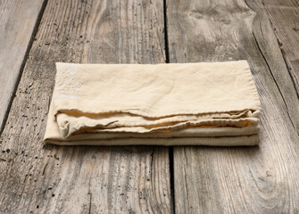 linen kitchen towel on a table made of old wooden boards, top view