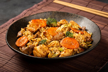 Yakisoba noodles. Yakisoba dish with meat, chicken and vegetables.