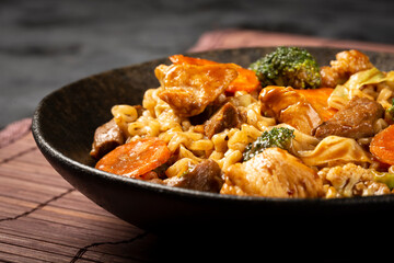 Yakisoba noodles. Yakisoba dish with meat, chicken and vegetables.
