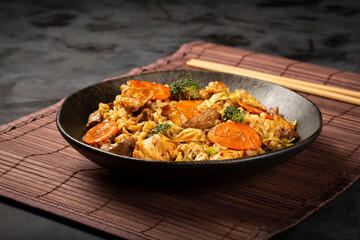 Yakisoba noodles. Yakisoba dish with meat, chicken and vegetables.