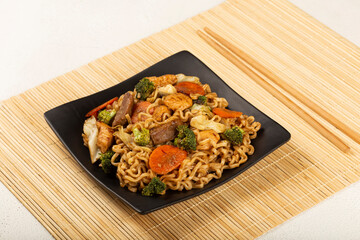 Yakisoba noodles. Yakisoba dish with meat, chicken and vegetables.