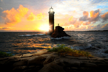 Lighthouse keeper stretches out his arms on lighthouse with beacon at stormy sunset evening sea -...